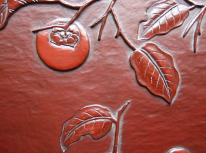 柿雀文様壁飾りの、柿の実と葉の拡大画像です。